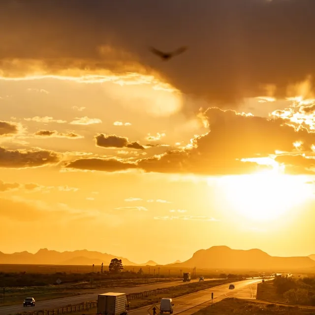 Sun Setting Over Interstate Traffic in West Texas