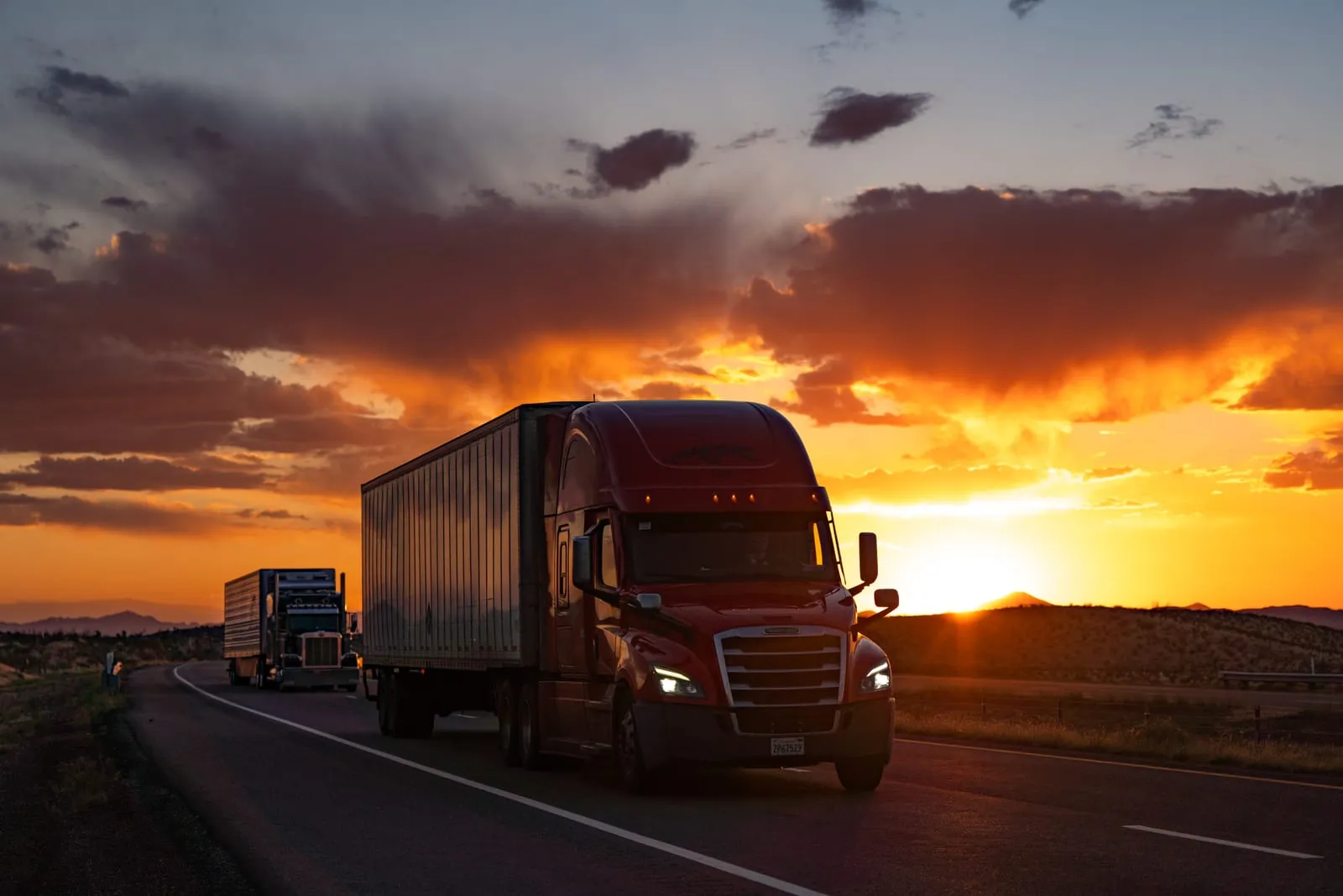Semi Truck Silhouetted Against the Setting Sun