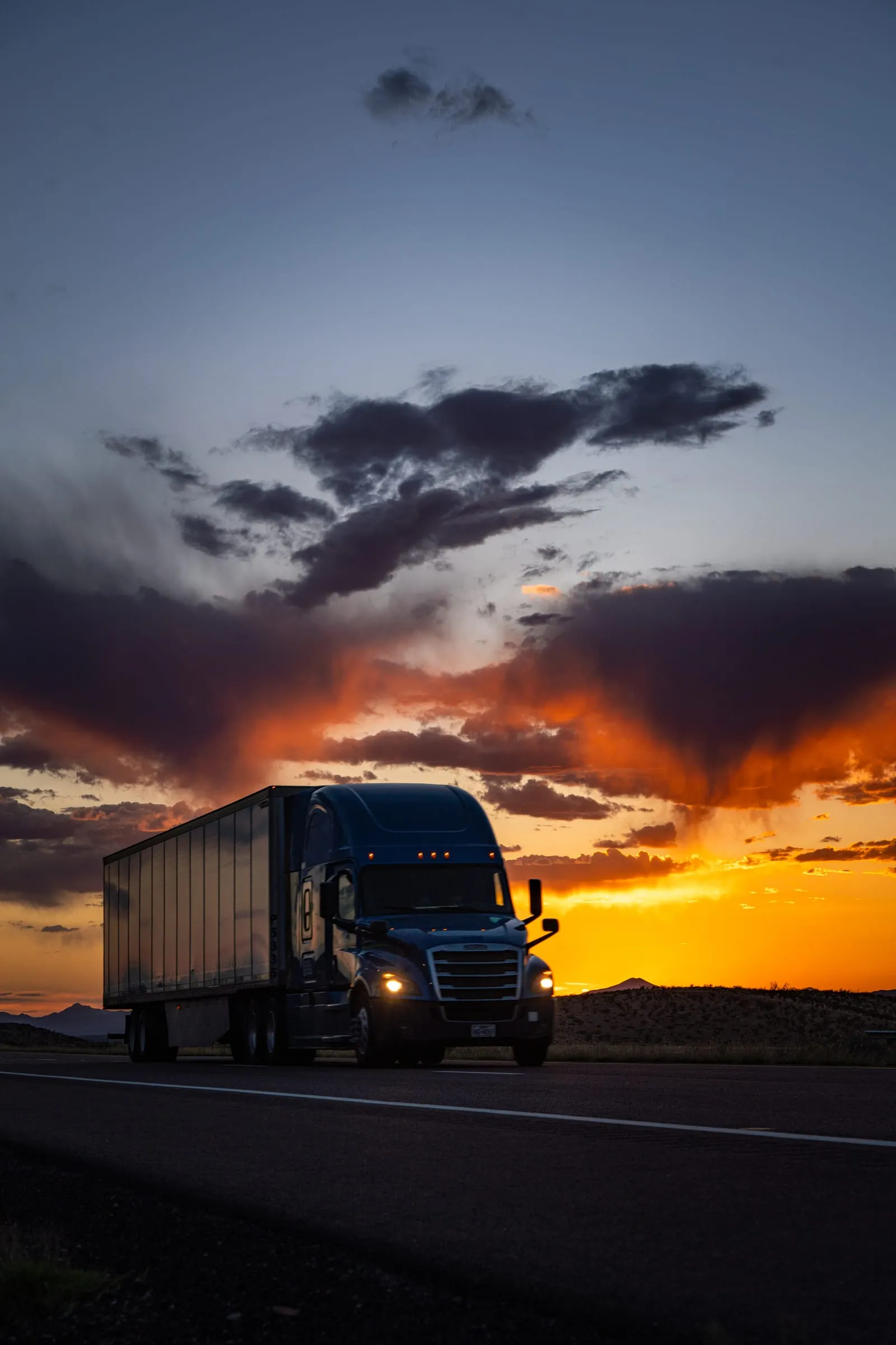 Semi Truck Silhouette Under a Dusk Sky, West Texas